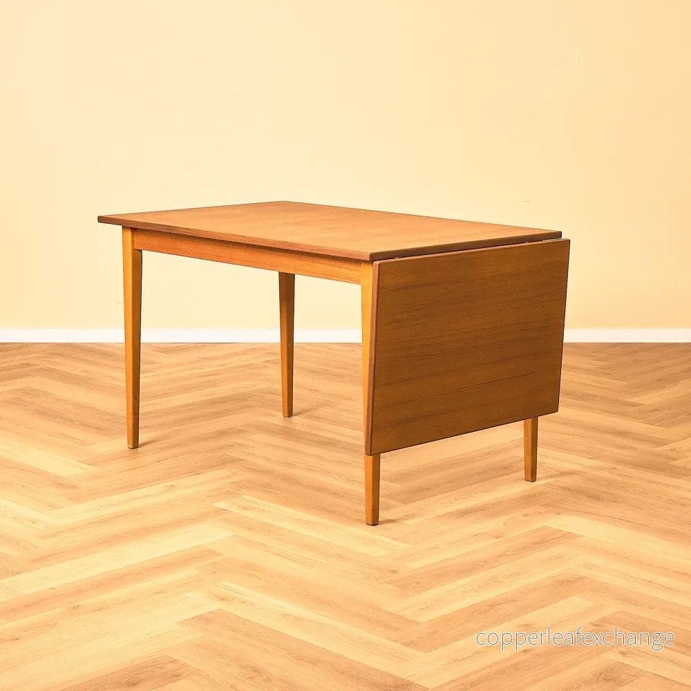 Svenskt rektangulärt bord i teak och bok Svenskt rektangulärt bord i teak och bok