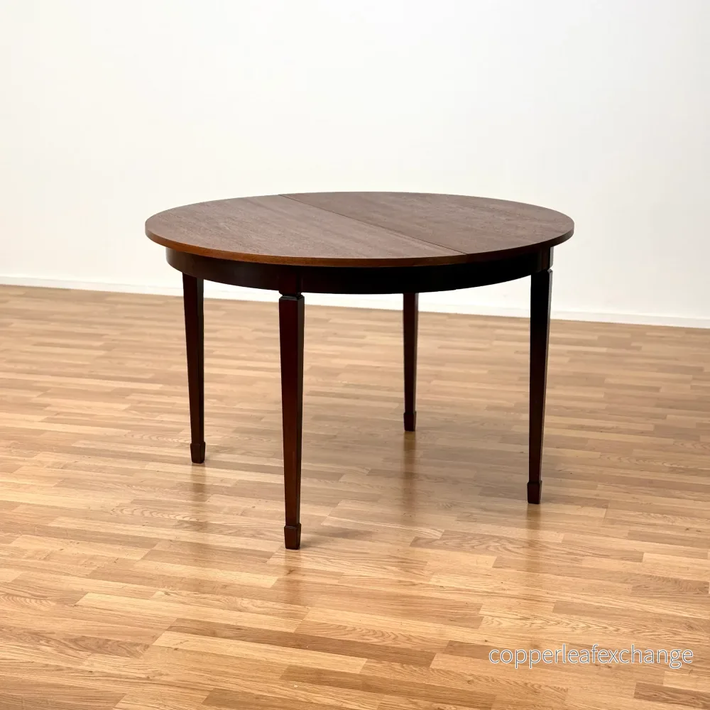 Runt matbord med 1 iläggsskiva i mahogny, 1950-60-tal